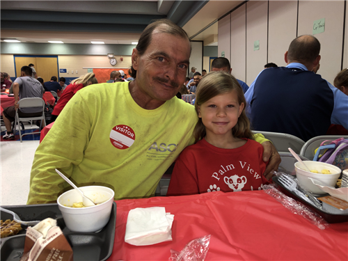 dad hugging daughter