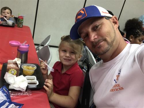dad taking a selfie with daughter