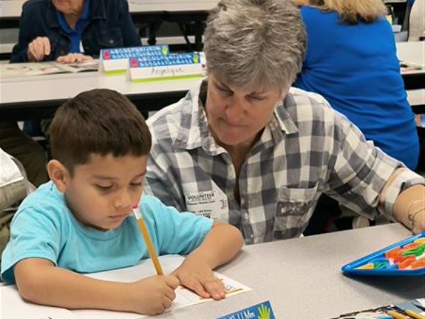 Picture of student with a reader